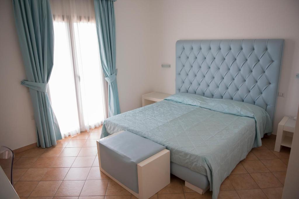 Postel nebo postele na pokoji v ubytování Hotel Caluna Charme