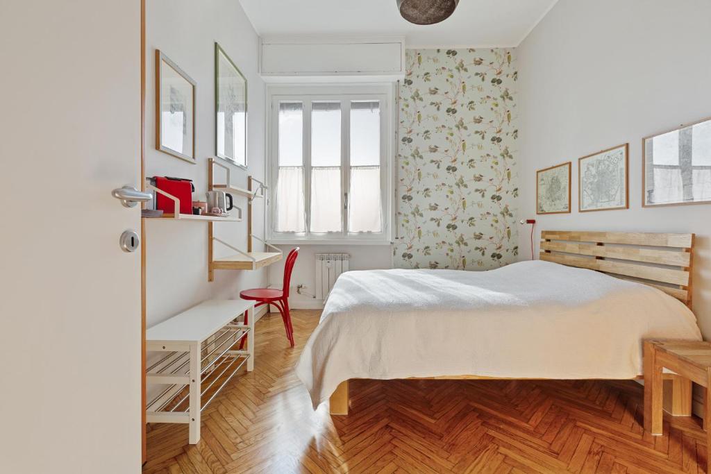 a bedroom with a bed and a desk and a window at Bed & Breakfast San Calocero - private bathroom - Wi-Fi in Milan