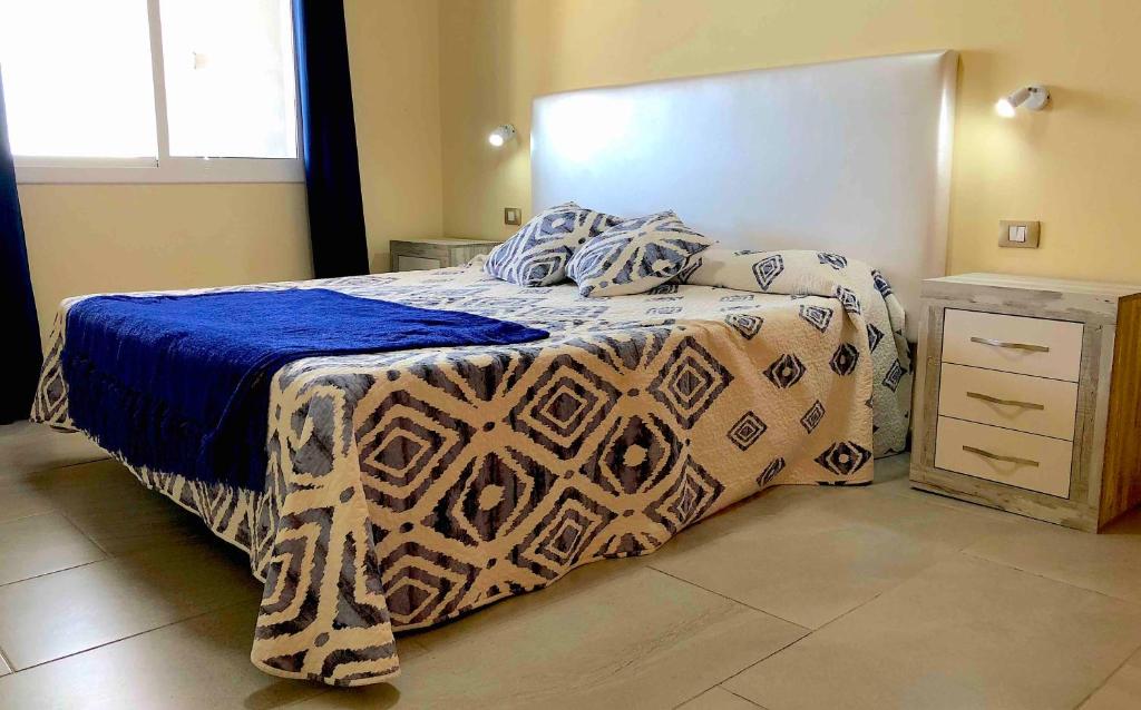 Posteľ alebo postele v izbe v ubytovaní Apartamentos La Puntilla Mogan