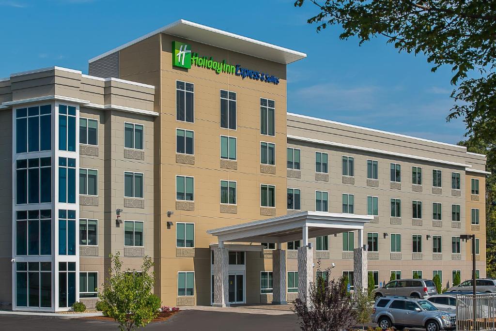 an office building with a hilton courtyard hotel at Holiday Inn Express & Suites Norwood, an IHG Hotel in Norwood
