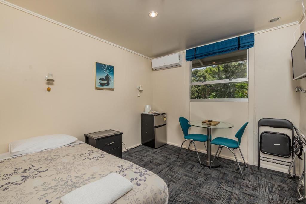 Postel nebo postele na pokoji v ubytování Riverside Lodge Paihia