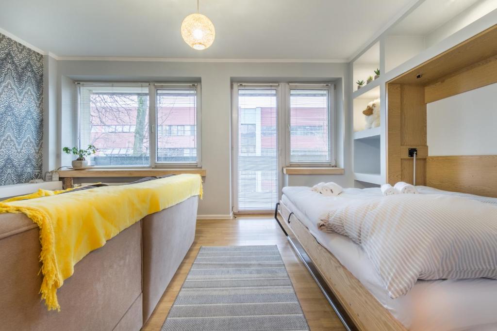 Posteľ alebo postele v izbe v ubytovaní Apartament Biały Miś Centrum
