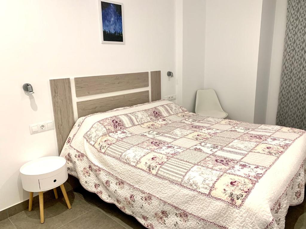 A bed or beds in a room at Edifici Valeria