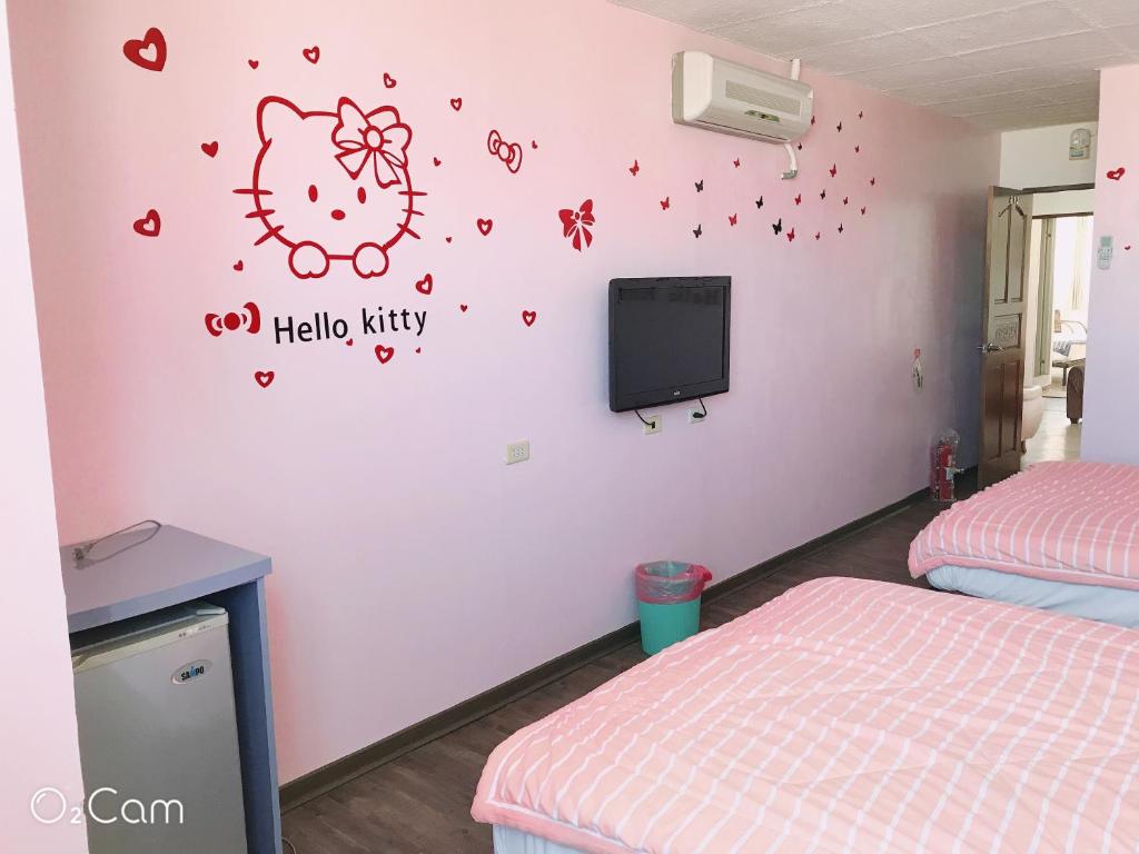 Postel nebo postele na pokoji v ubytování Sheng Feng Homestay