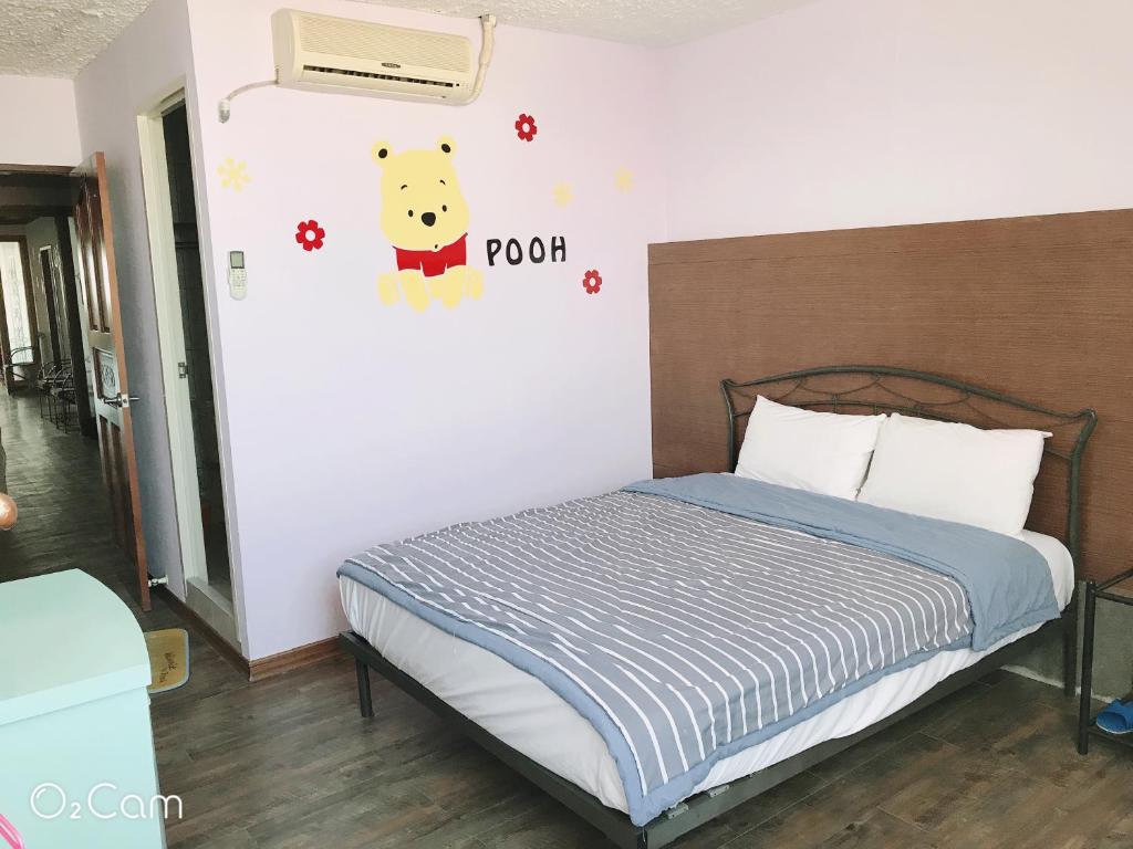 Postel nebo postele na pokoji v ubytování Sheng Feng Homestay