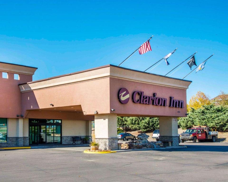 a clinton inn sign on top of a building at Clarion Inn and Events Center Pueblo North in Pueblo