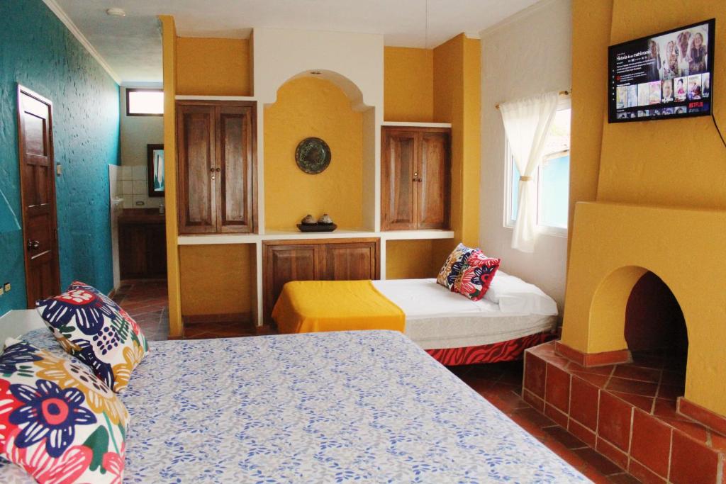 Postel nebo postele na pokoji v ubytování Casa Amarilla