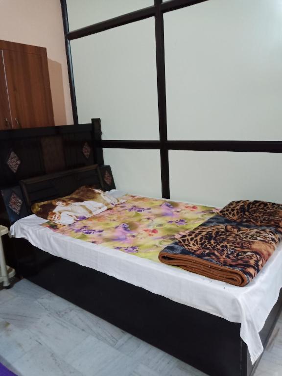 Postel nebo postele na pokoji v ubytování Sunita homestay