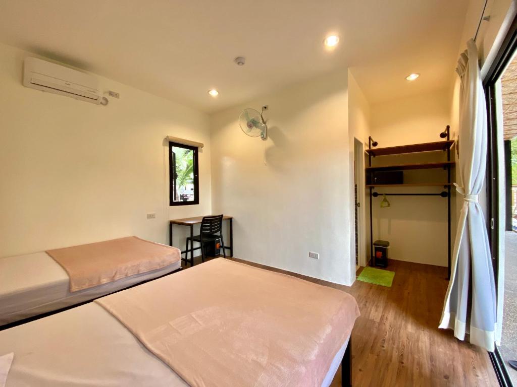 Postel nebo postele na pokoji v ubytování Casa de Moalboal