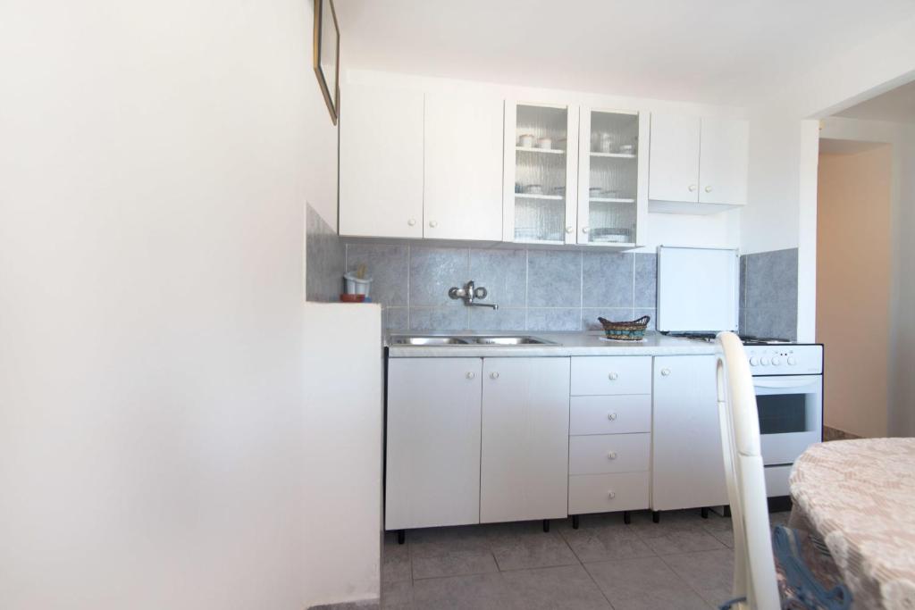 Kuchyň nebo kuchyňský kout v ubytování Apartments Jaksa