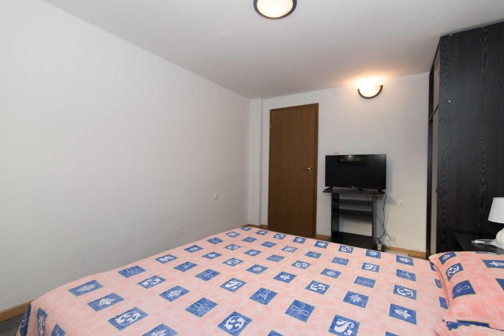Postel nebo postele na pokoji v ubytování Apartments Jaksa