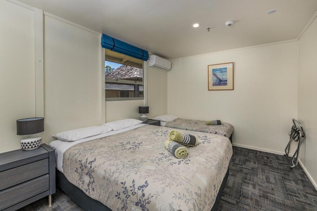 Postel nebo postele na pokoji v ubytování Riverside Lodge Paihia