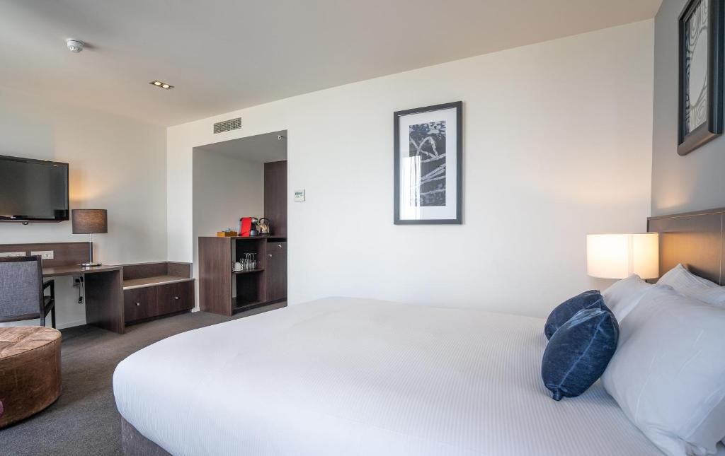 Postel nebo postele na pokoji v ubytování Scenic Hotel Dunedin City