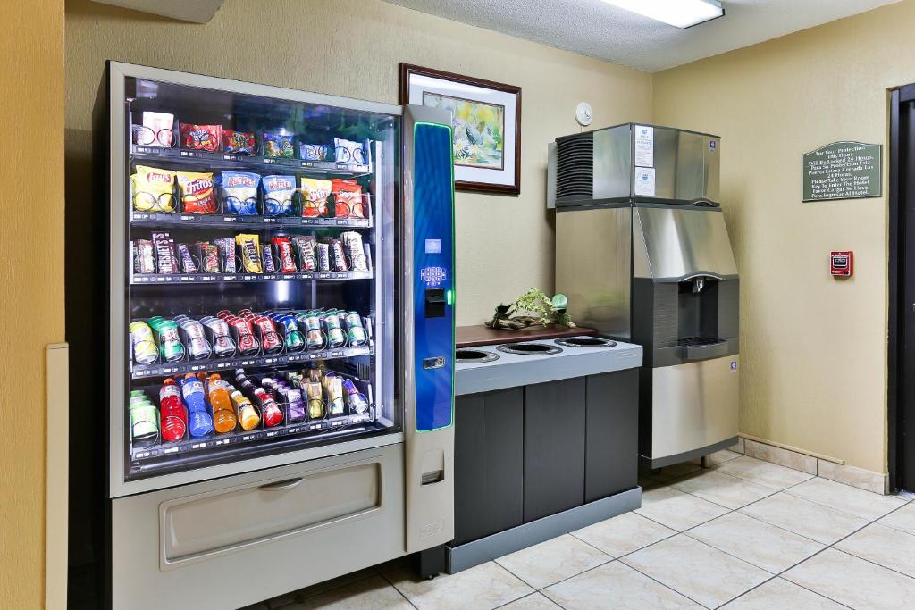 a refrigerator filled with lots of soda at Holiday Inn Express San Jose Costa Rica Airport by IHG in Alajuela City