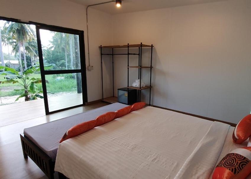 Postel nebo postele na pokoji v ubytování Koh Kood Chalet