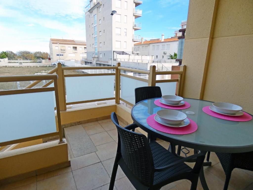 a table and chairs on a balcony with a view at Anacasa Avinyo Sector 5 AP121 in Oliva