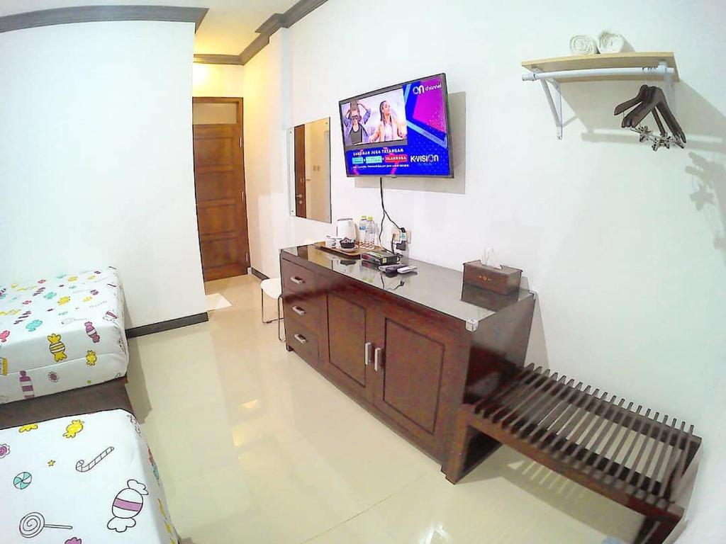 TV a/nebo společenská místnost v ubytování Amaryllis Guesthouse Syariah