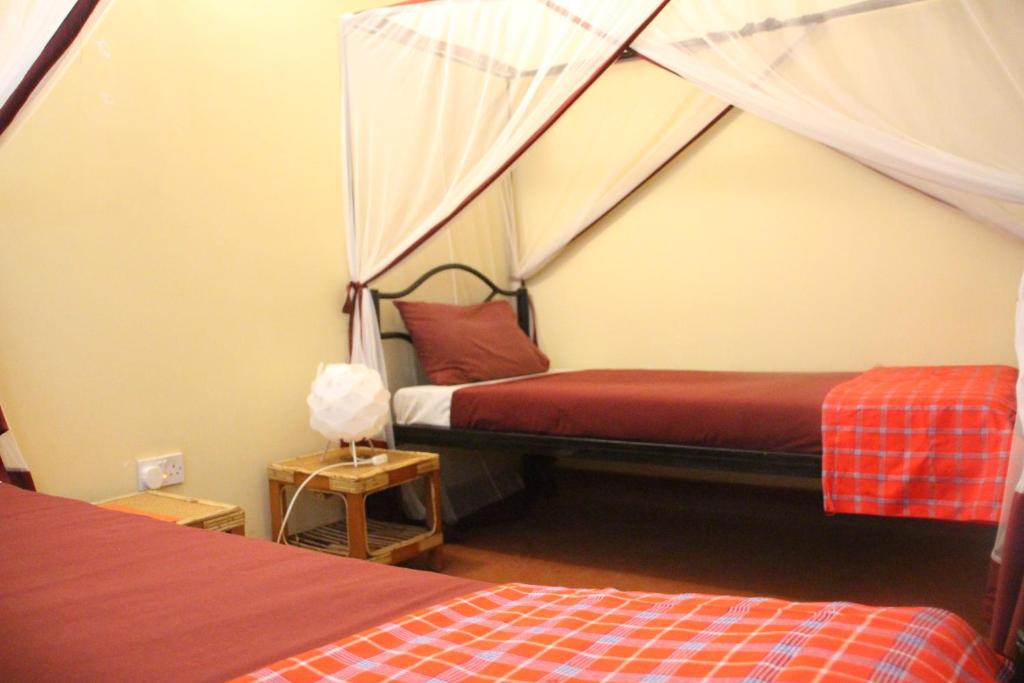 Postel nebo postele na pokoji v ubytování Red Chilli Hideaway