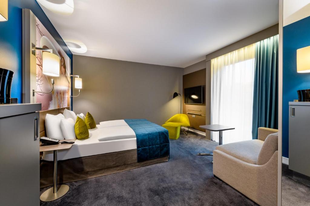 Postel nebo postele na pokoji v ubytování MERCURE Hotel Berlin Wittenbergplatz