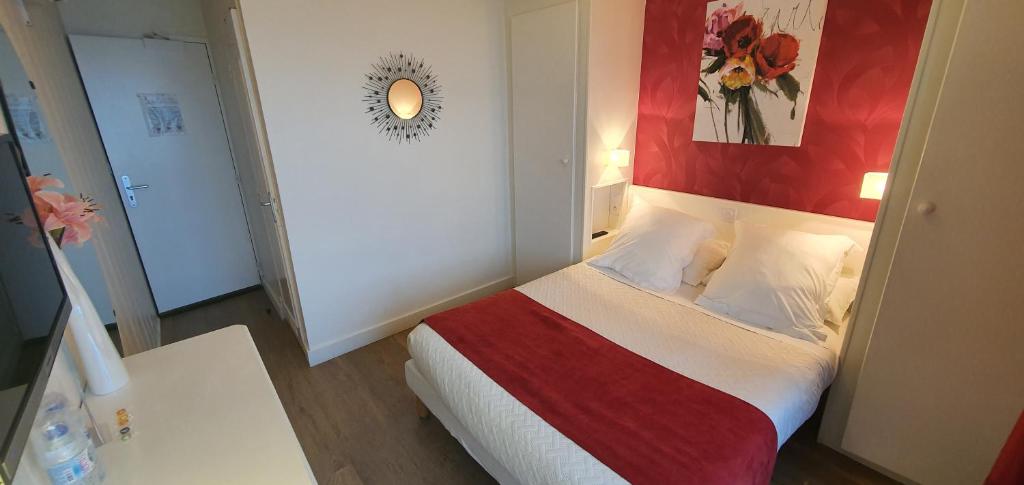 Postel nebo postele na pokoji v ubytování Hotel Cote d'Argent