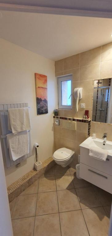 Koupelna v ubytování Hotel Cote d'Argent