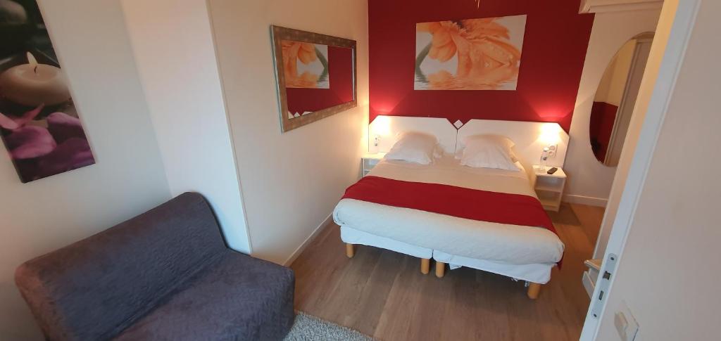 Postel nebo postele na pokoji v ubytování Hotel Cote d'Argent