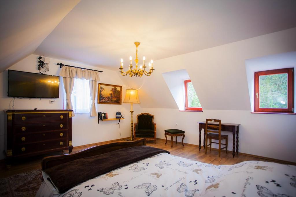 Postel nebo postele na pokoji v ubytování Grabensia Fogadó