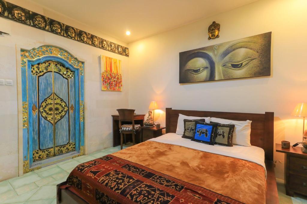 Postel nebo postele na pokoji v ubytování Ubud Chez Nyoman