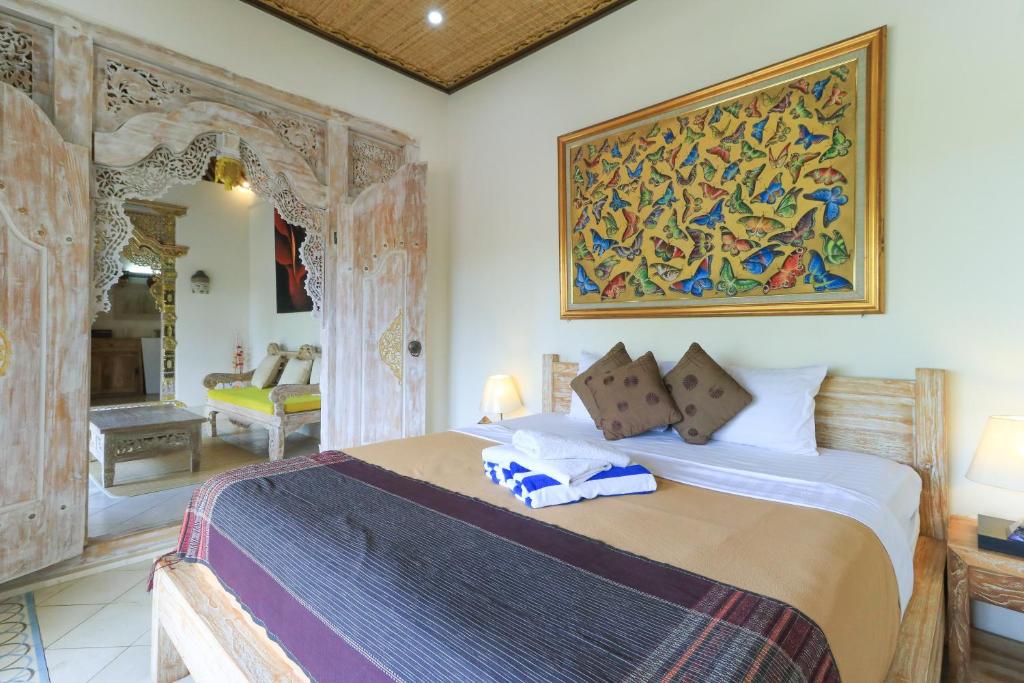 Postel nebo postele na pokoji v ubytování Ubud Chez Nyoman