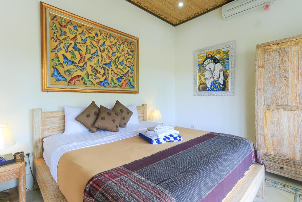 Postel nebo postele na pokoji v ubytování Ubud Chez Nyoman