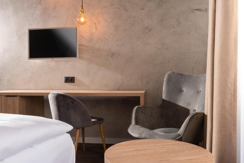 TV a/nebo společenská místnost v ubytování ibis Styles Dresden Neustadt