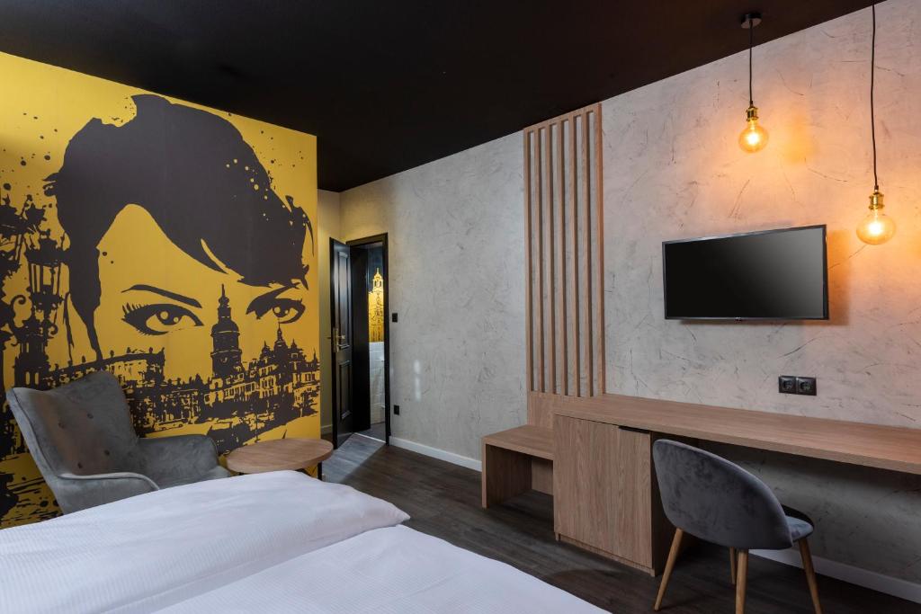 TV a/nebo společenská místnost v ubytování ibis Styles Dresden Neustadt