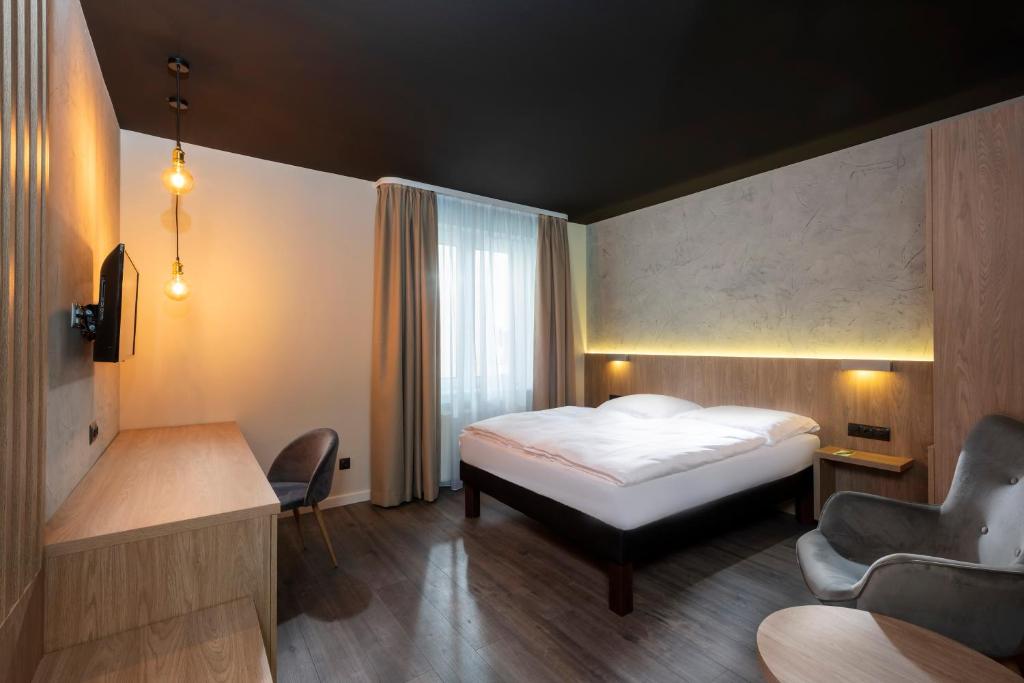 Postel nebo postele na pokoji v ubytování ibis Styles Dresden Neustadt