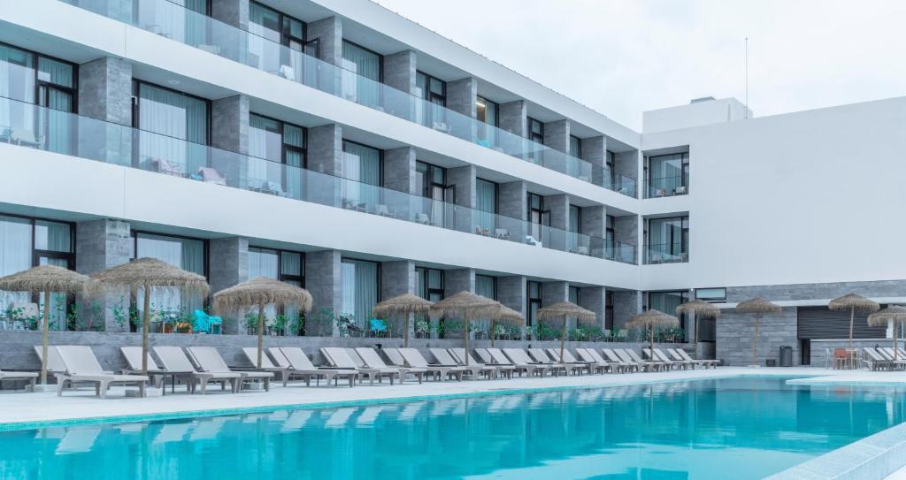 an image of a hotel with a swimming pool at Hotel Verde Mar & SPA in Ribeira Grande