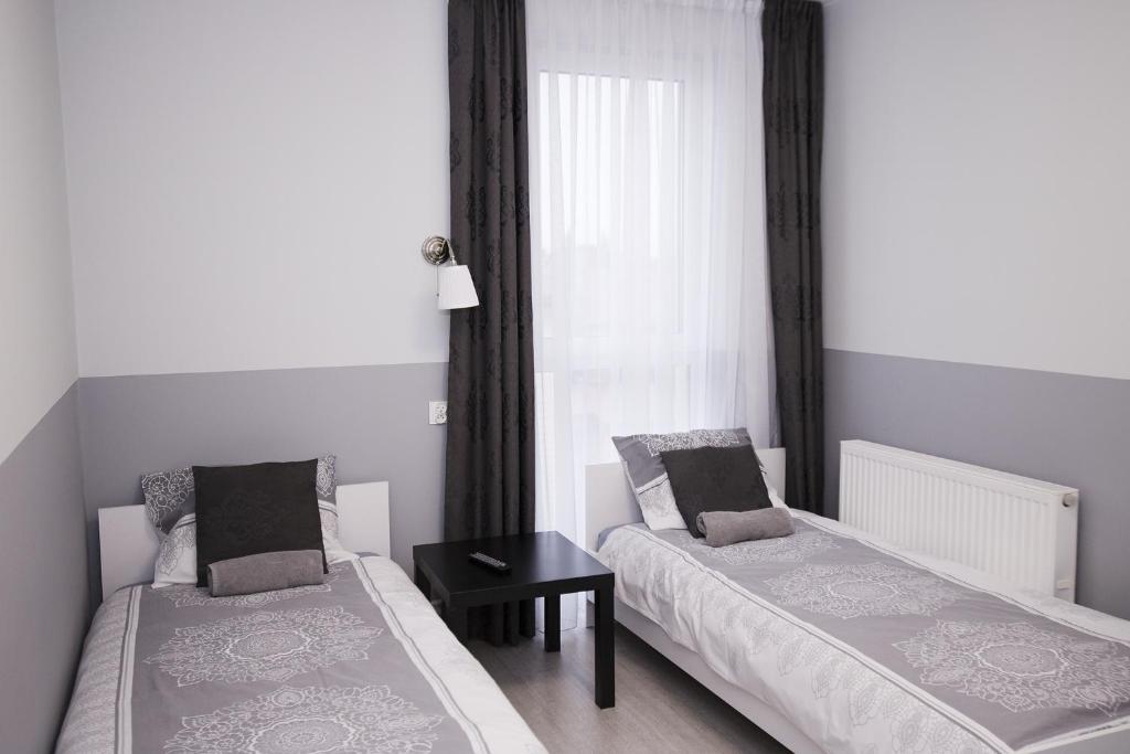 Posteľ alebo postele v izbe v ubytovaní White Home Room