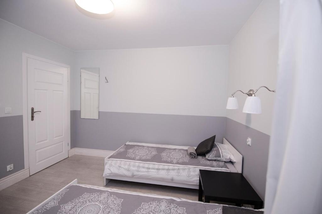 Posteľ alebo postele v izbe v ubytovaní White Home Room
