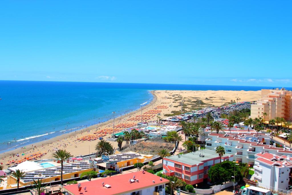 a view of a beach and the ocean at HL Suitehotel Playa del Inglés - Adults Only in Playa del Ingles