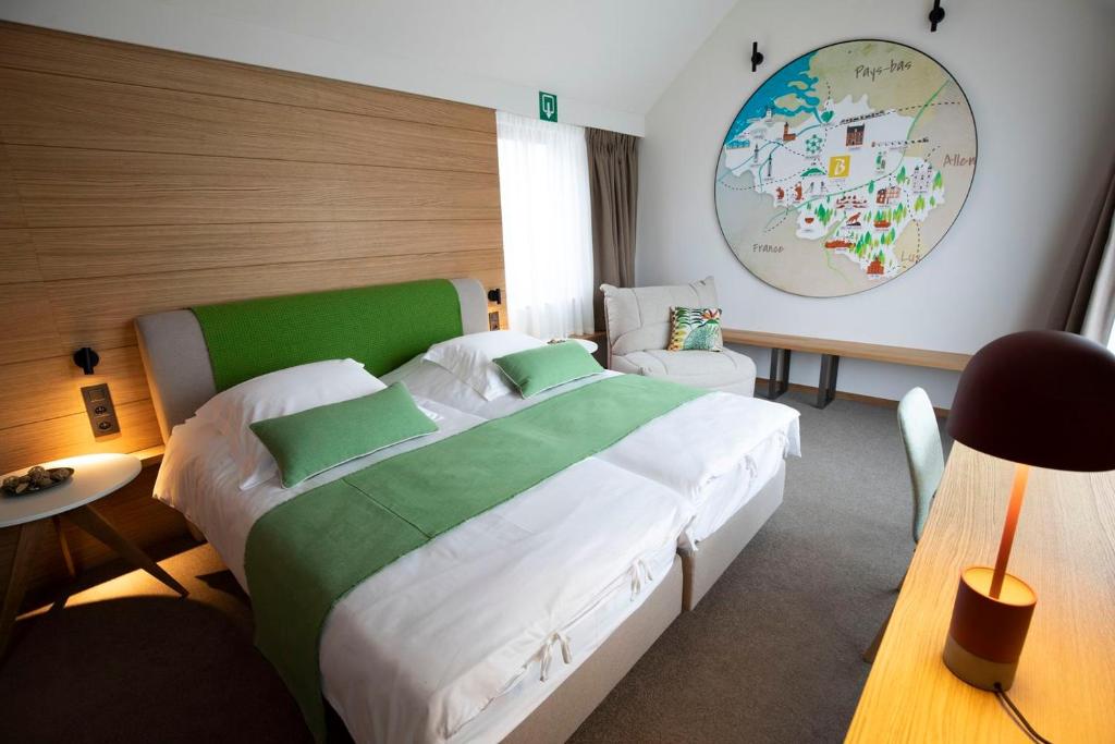 Postel nebo postele na pokoji v ubytování B-Lodge Boutique Hôtel