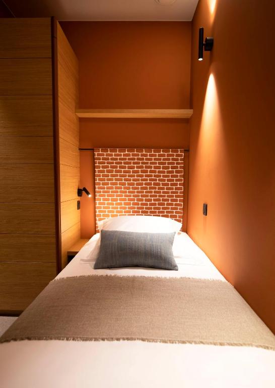 Postel nebo postele na pokoji v ubytování B-Lodge Boutique Hôtel
