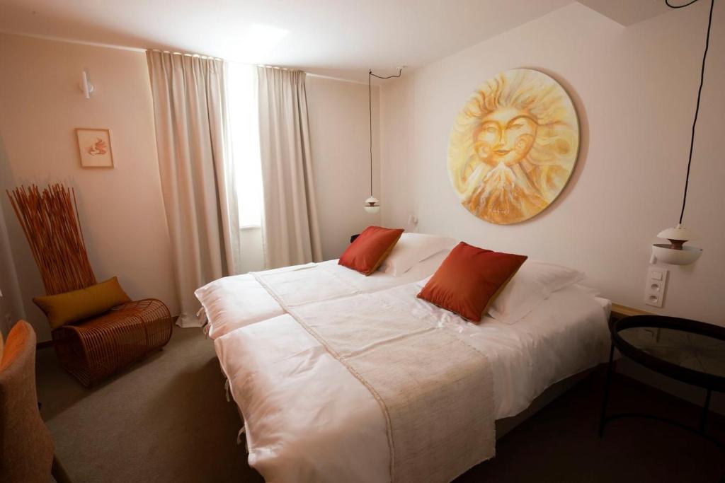 Postel nebo postele na pokoji v ubytování B-Lodge Boutique Hôtel