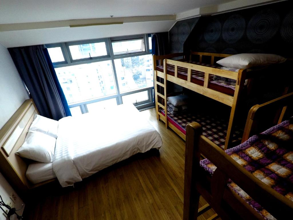 Postel nebo postele na pokoji v ubytování Busan Popcorn Hostel