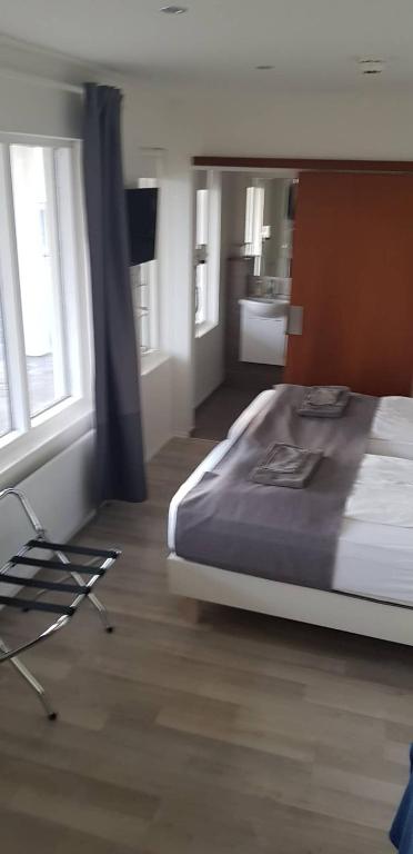 Postel nebo postele na pokoji v ubytování Apotek Guesthouse