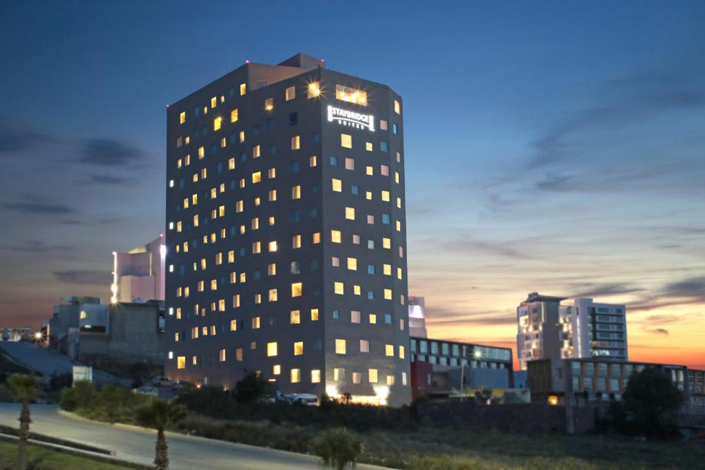 a tall building with lights on in a city at Staybridge Suites San Luis Potosi, an IHG Hotel in San Luis Potosí