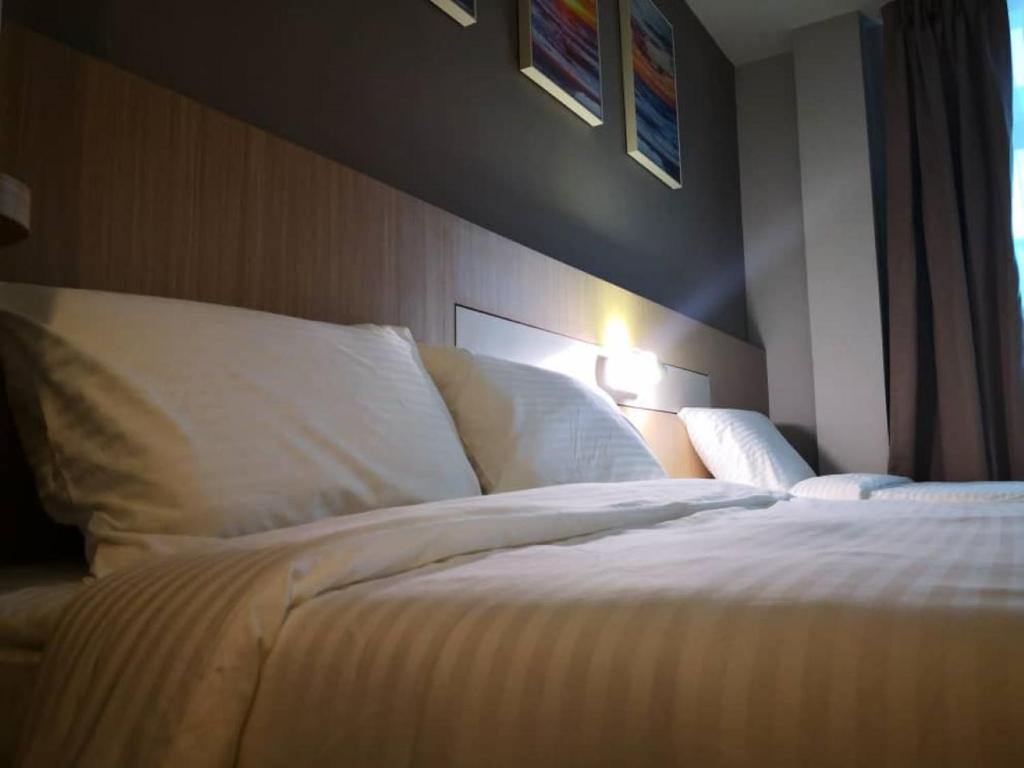 Postel nebo postele na pokoji v ubytování Walk In Hotel