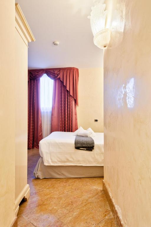 Postel nebo postele na pokoji v ubytování Hotel Vecellio Venice on the Lagoon