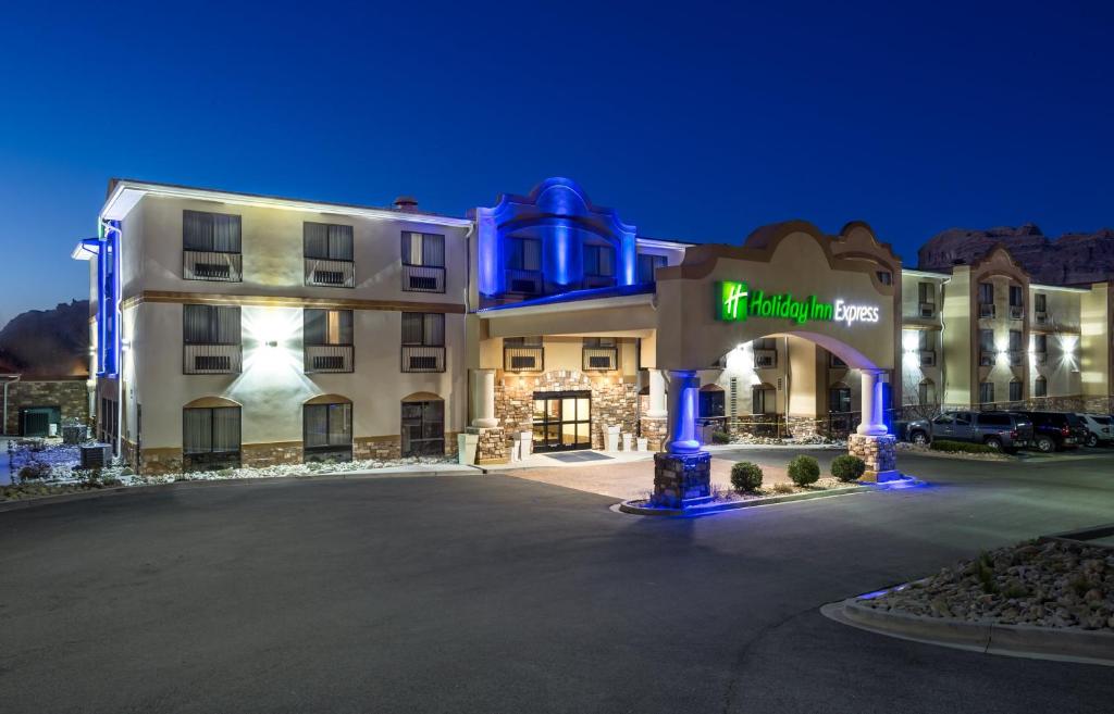 a large building with a red light in the middle of it at Holiday Inn Express Hotel & Suites Moab, an IHG Hotel in Moab