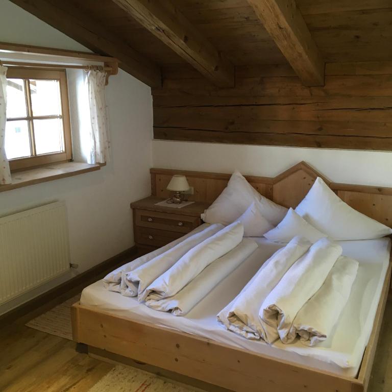 Postel nebo postele na pokoji v ubytování Dorf Alm