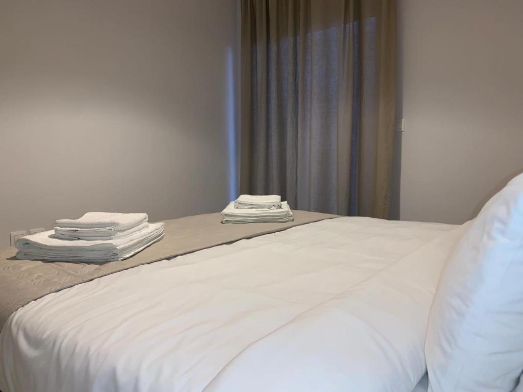 A bed or beds in a room at Treasure cosy flat