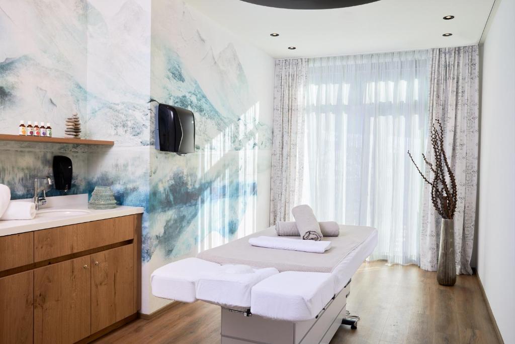 Postel nebo postele na pokoji v ubytování Zugspitz Resort