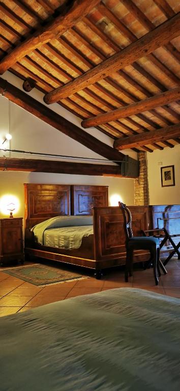 Posteľ alebo postele v izbe v ubytovaní Agriturismo-R&B Corte dei Gioghi